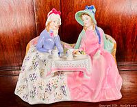 Front angled view of the Royal Doulton Afternoon Tea figurine showing both women sitting at the tea table with detailed colors and facial features.