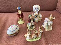 All six items grouped together on a red fabric surface showing the overall lot and color details.