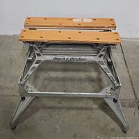 Front view of Black & Decker workmate workbench showing wooden slats top and metal frame with branding.