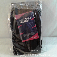New 3-in-1 hinged knee brace sealed in original packaging with visible user manual inside.