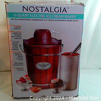 Box of Nostalgia 6-Quart Electric Ice Cream Maker showing wood barrel design and product features.