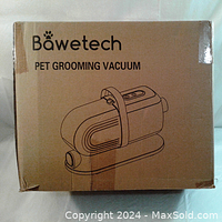 Photograph of the boxed Bawetech Pet Grooming Vacuum