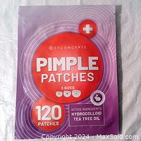 Front view of purple pouch packaging with orange highlights showing brand Key Concepts, product name Pimple Patches, 120 patches, cruelty-free symbol and active ingredients hydrocolloid and tea tree oil.