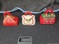 All three ceramic purse cookie jars displayed side by side
