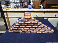 Front view of pyramid stack showing multiple unopened Cure bandage boxes