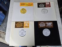 Four Outkast vinyl singles in sleeves laid out