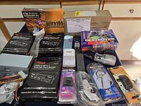 Overview of boxed and loose electronic parts on table