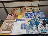 All 18 booklets laid out to show covers