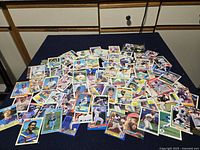 Wide view of scattered baseball cards showing variety