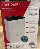 Frigidaire dehumidifier boxed packaging showing model number, features, and capacity.