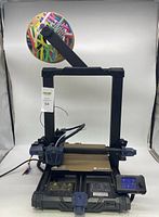 Full front view of the Anycubic Kobra Go 3D printer with filament spool mounted on top