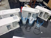 Boxes of Vanling drinking glasses and some glasses out of the box for inspection.