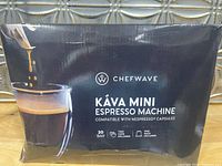Front and side views of the ChefWave Káva Mini Espresso Machine original box, showing product branding and features.