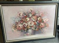 Overall view of the framed oil painting showcasing the floral bouquet with chunky paint texture and signature.