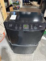 Front view showing entire dehumidifier and control panel