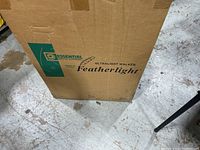 Box front corner showing Essential Medical Supply logo and product name Ultralight Walker Featherlight.
