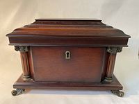 Front view of the wooden jewelry box showing tiered lid and front keyhole