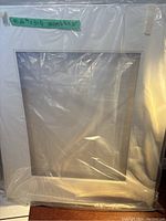 Double matted white matte wrapped in plastic, showing smooth and clean finish