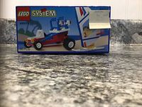 Front of LEGO box with printed image of assembled Beach Bandit dune buggy and minifigure, product name and piece count visible.