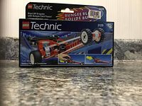 Front of the LEGO Technic Blast Off Dragster set #2129 box showing the dragster with bungee cord power and box details