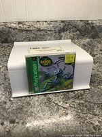 Photo of the PlayStation 1 game case for 'A Bug's Life' titled game showing cover art with blue ant Flik and price sticker.