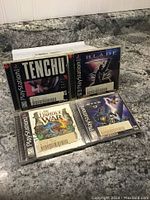 Four PlayStation 1 game cases: Tenchu, Blade, The Unholy War, and one with a fantasy theme cover.