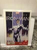 Front cover of Superior Iron Man issue #1 showing Iron Man in silver and black armor.