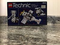 Front of unopened LEGO Technic 8022 box showing models and piece count of 117.
