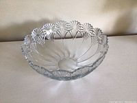 Crystal salad bowl with scalloped edge and detailed cut glass pattern on the sides and base. Diameter approximately 12 inches.