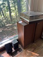 Photo showing the Phillips record player on top of two wooden Scott speakers plus two smaller black Realistic speakers on the floor.