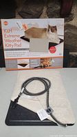 Photo of K&H Extreme Weather Kitty Pad box and pet pad with fleece cover and steel wrapped power cord.