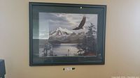 Straight-on view of framed print hanging on wall