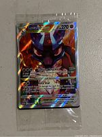 Holographic sealed Lucario VSTAR Pokémon card showing artwork, stats, and attacks clearly.