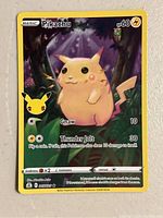Front view of Pikachu Celebrations Pokemon trading card showing art and moves.