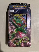 Front view of sealed Rayquaza V Battle Deck box with visible Rayquaza V card and price sticker $30.