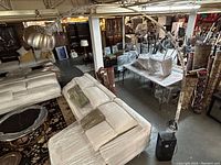 Full view of the arc floor lamp in warehouse setting