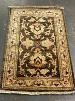 Full view of the rectangular handmade rug showing the overall Serai floral design and border.