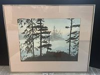 Full view of the framed watercolour painting showing the Isle of Glass landscape with tall trees in the foreground and misty island background.