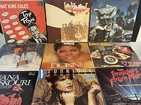 Front covers of 9 LP records showing various artists and genres including Nat King Cole, Led Zeppelin II, Dionne Warwick and others.