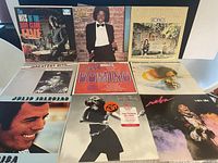 Front covers of 9 LP vinyl records showing artwork and artist names.