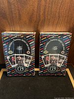 Two unopened boxes of Ultimate 6 Original Premium Hockey Card Series hockey cards placed side by side.