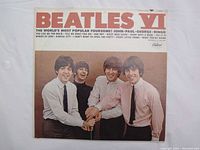 Front cover of Beatles VI vinyl album showing Beatles members smiling in white shirts and ties