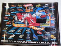 Poster showing Hot Wheels 30th Anniversary Collection with cars in a circular layout, main red car in center, some Hot Wheels cars in sealed packaging on top