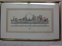 Full view of the framed artwork showing the St. Louis skyline with the Gateway Arch and signature of John Pils beneath the artwork title.