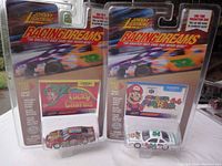 Two packaged Johnny Lightning Racing Dreams diecast cars, #15 Lucky Charms and #84 Super Mario 64.