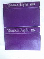 1984 and 1985 United States Proof Set original purple mint packaging envelopes with year labels