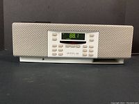Front view of the Henry Kloss Model 88 tabletop radio, showing perforated speaker grills on either side and the central control panel with digital display reading 88.1 FM stereo.