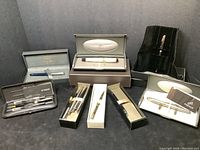 All pens and boxes displayed together on black background