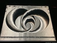 Full front view of the signed aluminum hologram print showing the spiral abstract design with artist signature and edition information along the bottom.