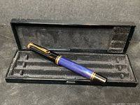 Pen resting in the original black box showing the full pen and box interior